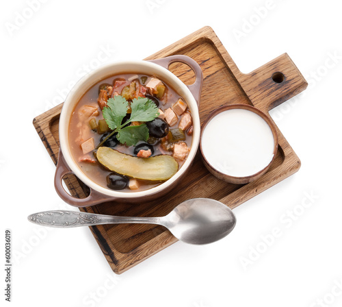 Pot of tasty Hodgepodge soup with sour cream on white background photo