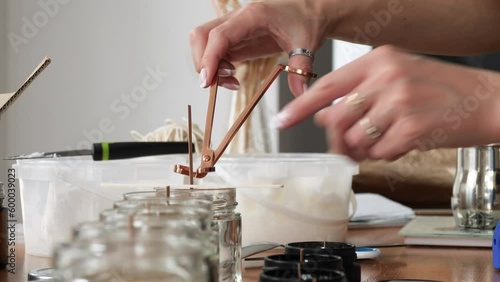 Close-up cutting the wick of a candle