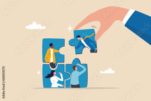 Fototapeta New joiner to fill in team and solve problem, teamwork to get solution, put right man in the right job to fit job description concept, businessman hand HR put new joiner to connect jigsaw puzzle