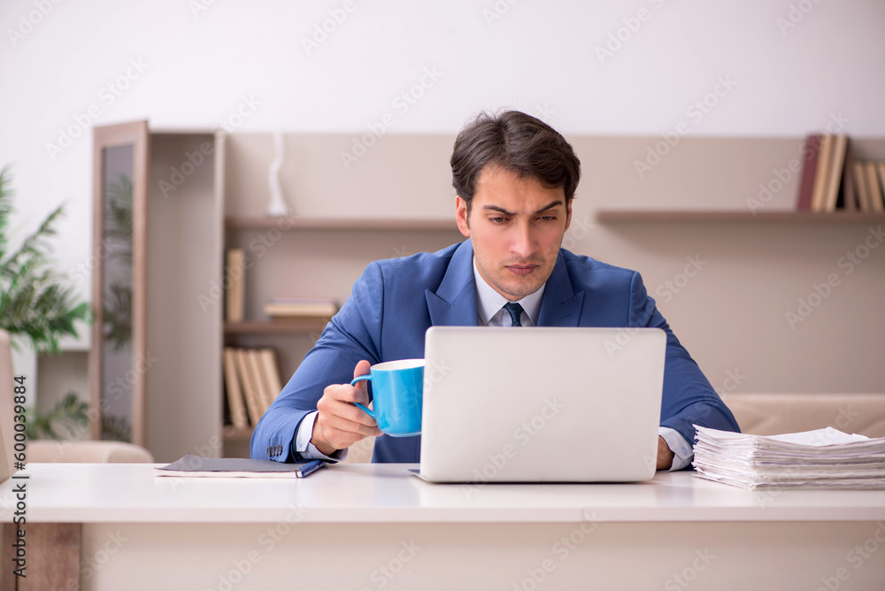 Young male employee working from home during pandemic Young male employee working from home during pandemic