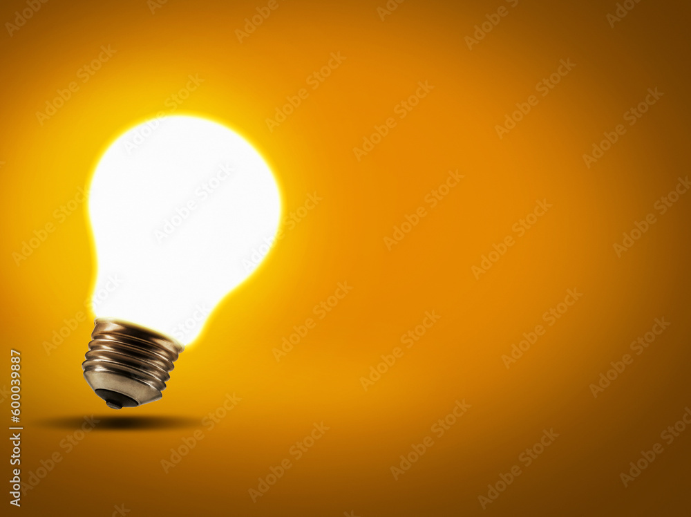 Energy, inspiration and lightbulb with a glow, innovation and science against studio background. Light, knowledge or enlightenment with ideas, growth and development with solution and problem solving Energy, inspiration and lightbulb with a glow, innovation and science against studio background. Light, knowledge or enlightenment with ideas, growth and development with solution and problem solving