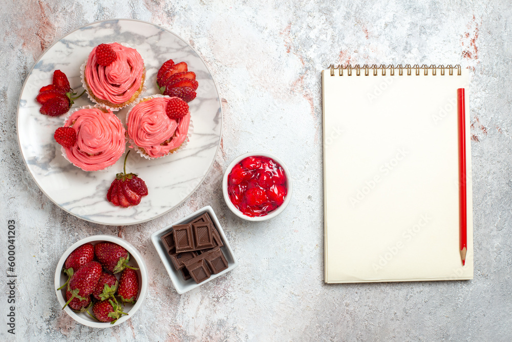 top view pink strawberry cakes with jam and chocolate bars on white background fruit tea cake biscuit sweet cookie top view pink strawberry cakes with jam and chocolate bars on white background fruit tea cake biscuit sweet cookie