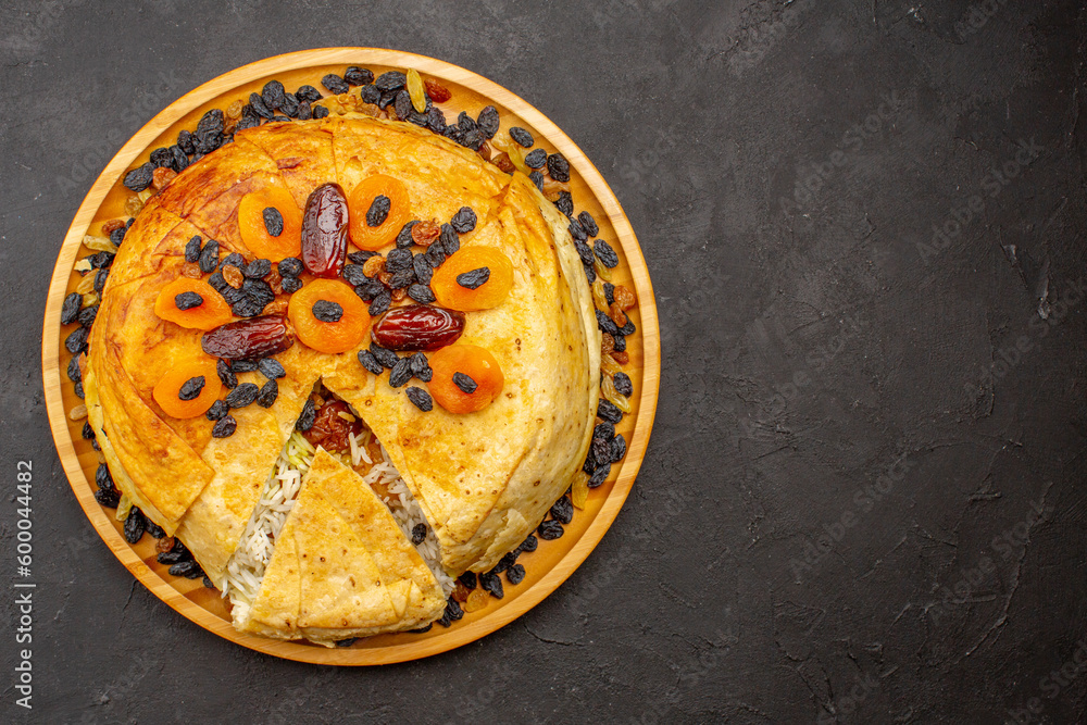 top view shakh plov delicious rice meal cooked inside round dough with raisins on the grey background rice cooking dough dinner meal top view shakh plov delicious rice meal cooked inside round dough with raisins on the grey background rice cooking dough dinner meal