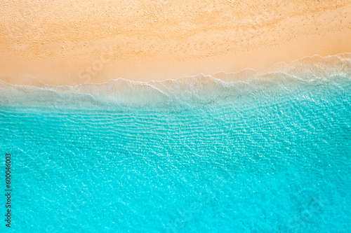 Relaxing sand waves aerial beach, summer vacation tropical Mediterranean landscape banner. Amazing blue ocean lagoon, sea shore coastline. Beautiful aerial drone top view. Peaceful beach, seaside surf