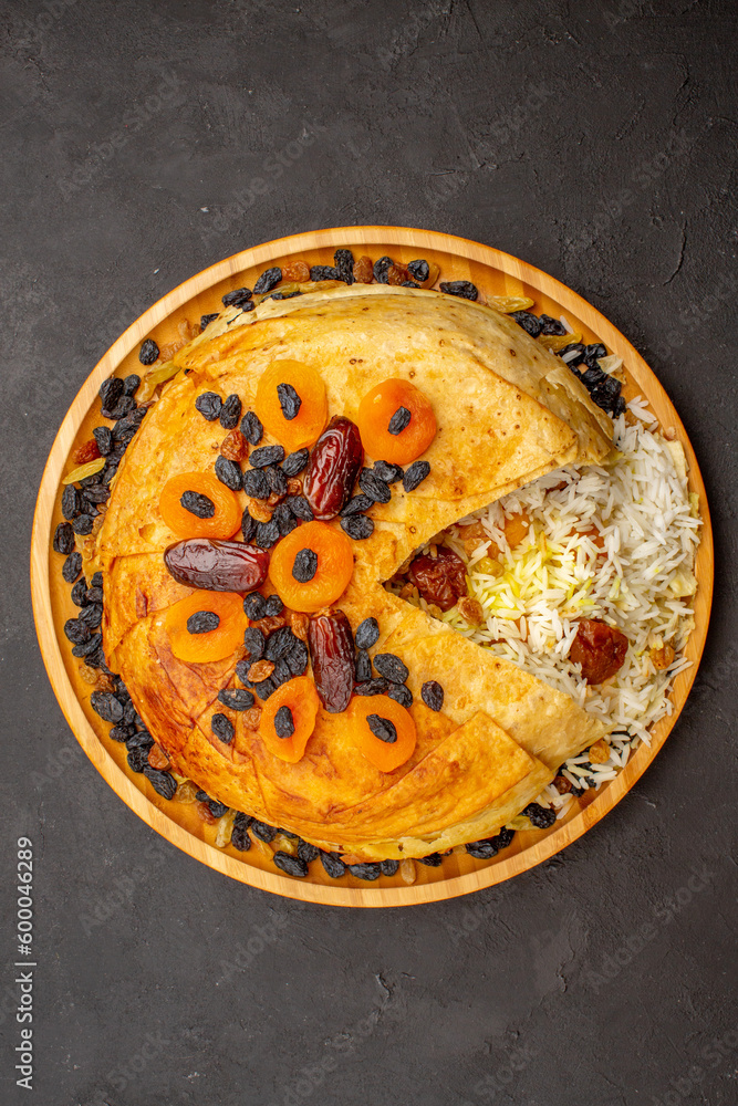top view tasty shakh plov with raisins and dried apricots on dark background meal cooking rice dough food top view tasty shakh plov with raisins and dried apricots on dark background meal cooking rice dough food