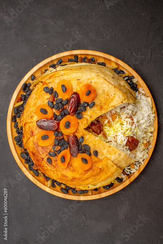 top view tasty shakh plov with raisins and dried apricots on dark background meal cooking rice dough food