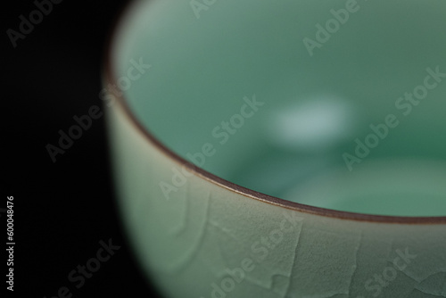 Longquan celadon from China, Chinese high-end tea set, celadon tea set with crack decoration, indoor dark background photo