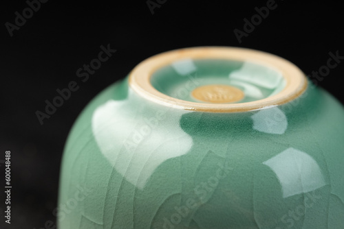 Longquan celadon from China, Chinese high-end tea set, celadon tea set with crack decoration, indoor dark background photo