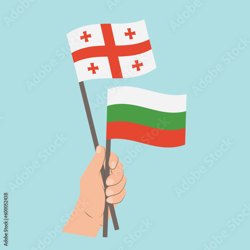 Flags of Georgia and Bulgaria, Hand Holding flags © Настасья Стось