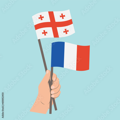 Flags of Georgia and France, Hand Holding flags