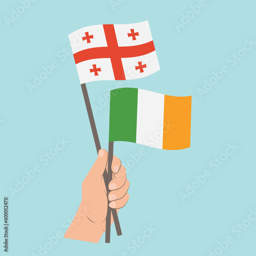 Flags of Georgia and Ireland, Hand Holding flags