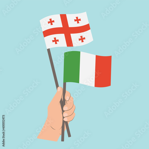 Flags of Georgia and Italy, Hand Holding flags