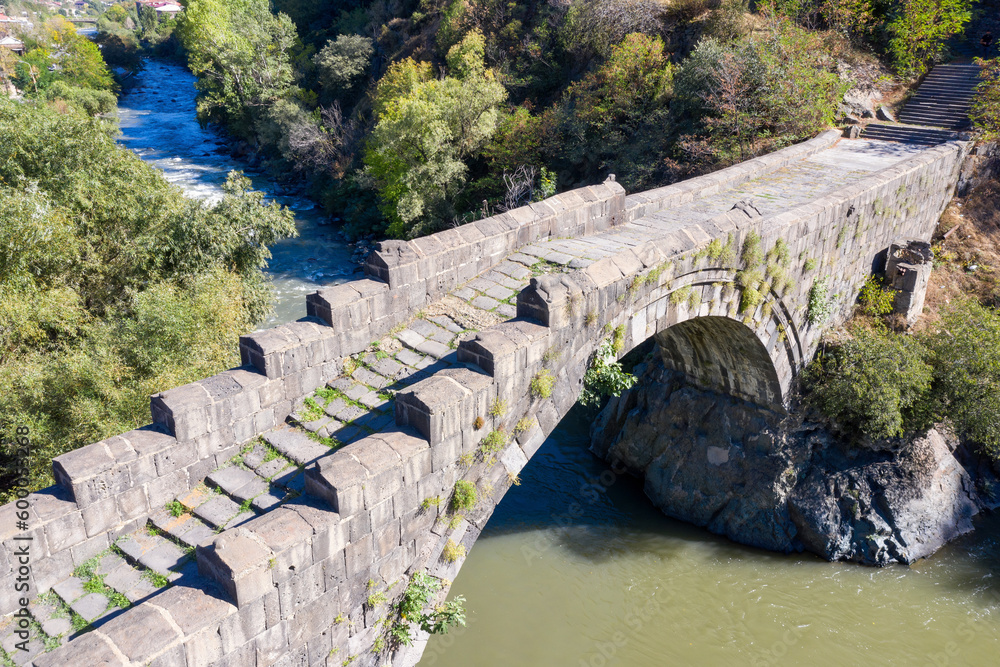 Aerial view of medieval Sanahin Bridge on sunny summer day. Alaverdi, Lori Province, Armenia.