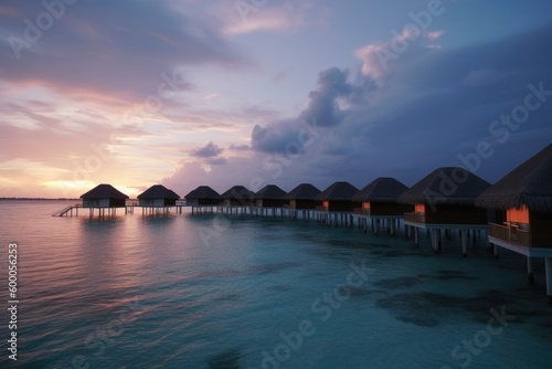 Amazing drone view of the beach and water with beautiful colors. Paradise scenery water villas with amazing sea and beach  tropical nature. summer vacation.