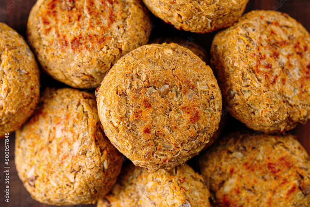 Portion of fresh vegetarian falafels on wooden board Portion of fresh vegetarian falafels on wooden board