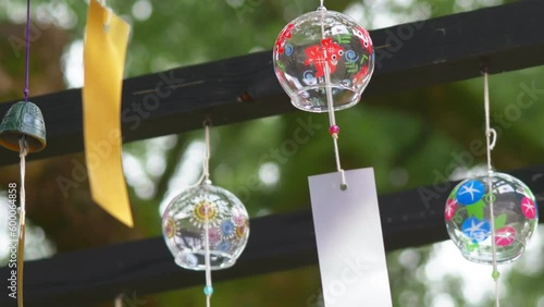 ‘Furin’ - Multiple Japanese traditional wind chime (bell) swaying in wind
 photo