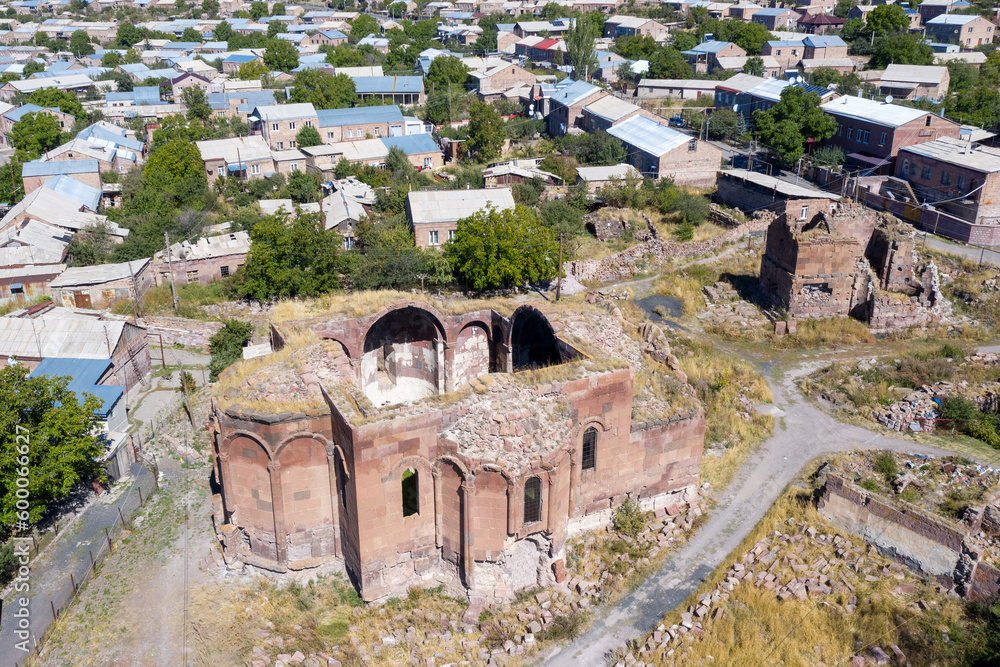 Aerial view of ruins of Surb Grigor church on sunny summer day. Artik town, Shirak Province, Armenia.