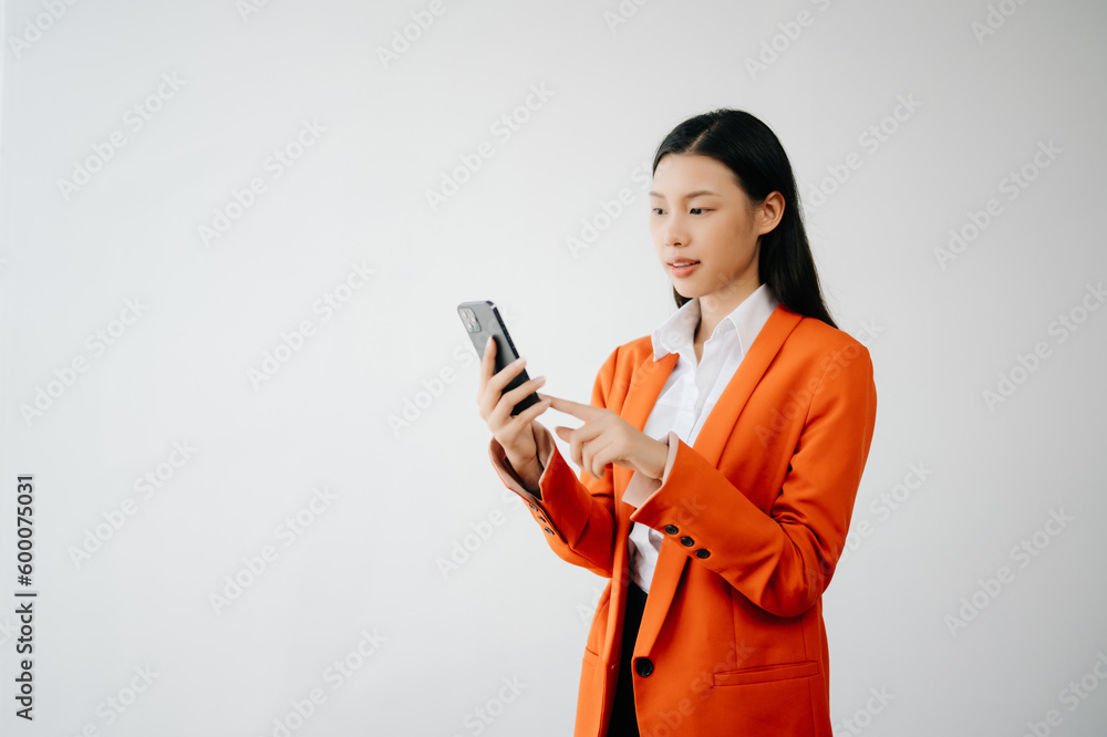 Portrait photo of young beautiful Asian woman feeling happy and holding smart phone, tablet and laptop with black empty screen on white background product presenting concept.. Portrait photo of young beautiful Asian woman feeling happy and holding smart phone, tablet and laptop with black empty screen on white background product presenting concept..