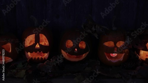 autumn carved pumpkin jack-o-lantern in the atmosphere of halloween, autumn still life with pumpkins blurred focus