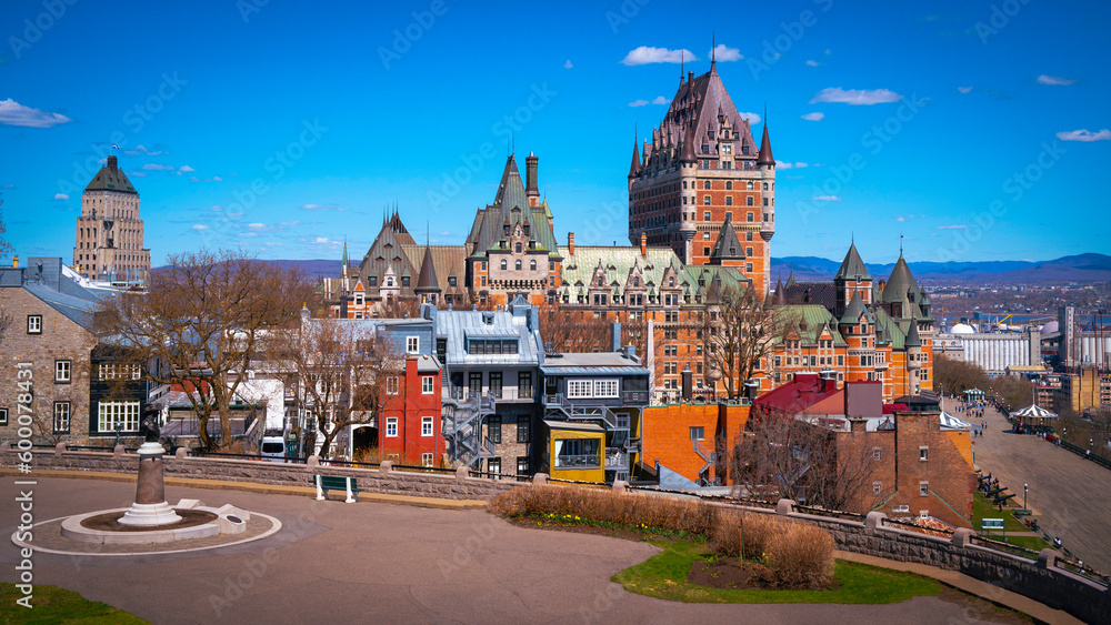 Fototapeta premium Quebec City vibrant spring colors, skyline, architecture, buildings, view of Fairmont Le Chateau Frontenac in Canada overlooking the St. Lawrence River