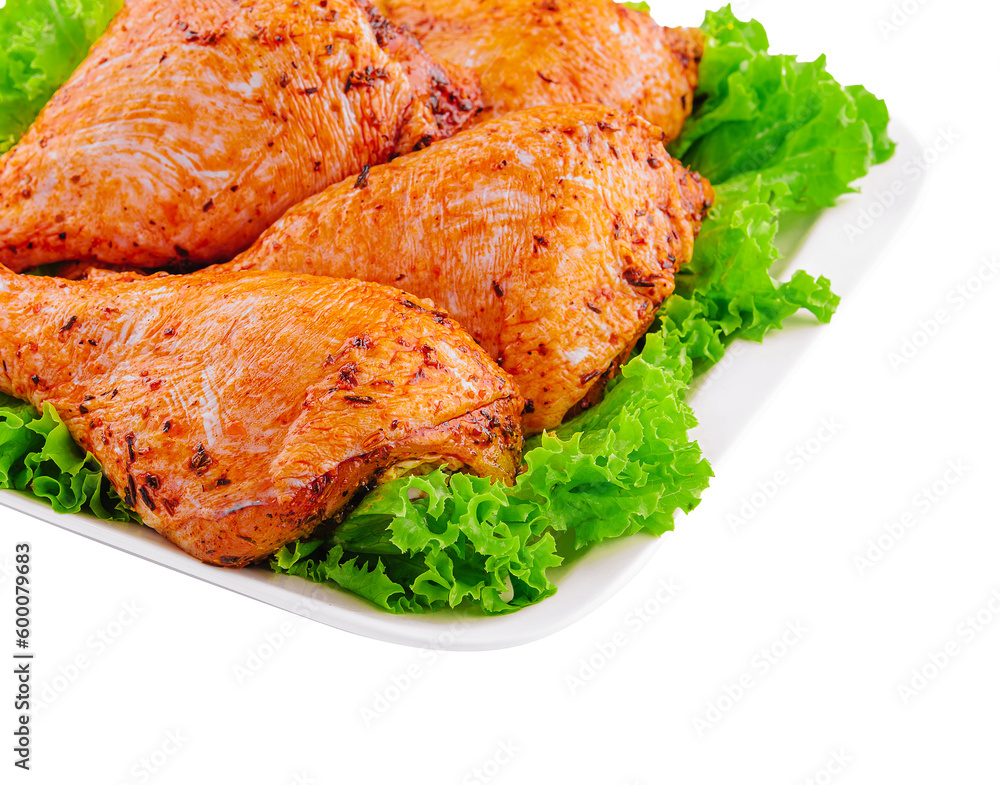 Raw uncooked marinated chicken legs on plate Raw uncooked marinated chicken legs on plate