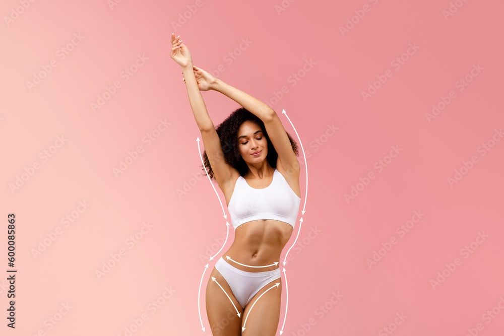 Bodycare and sculpting concept. Slim black lady in white top bra and panties with drawn lifting up lines on fit figure - obrazy, fototapety, plakaty 