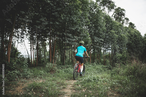 Riding bike in spring forest © lzf