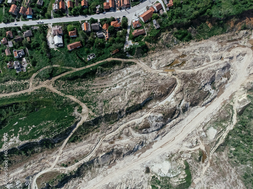 The abandoned, dead city near the Kolubara pit on coal mining by the open way. Drone view Lazarevac, Serbia photo
