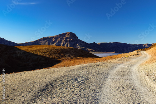 Mountain road in the desert towards a volcano on Teneriffa