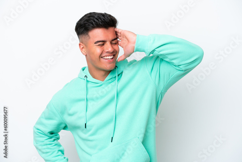 Young caucasian handsome man isolated on white background smiling a lot © luismolinero