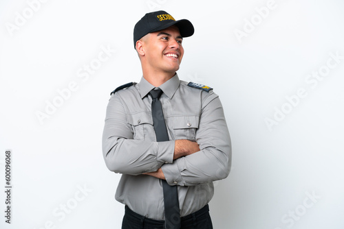 Young caucasian security man isolated on white background happy and smiling © luismolinero