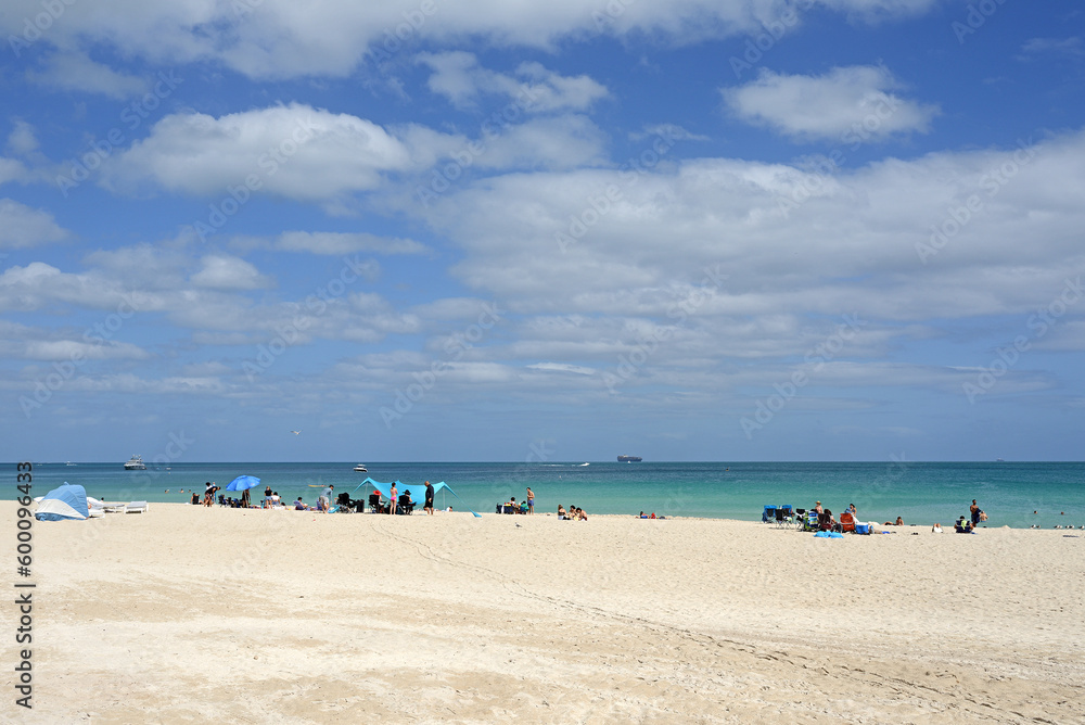 Paradise. Sunny sandy beach with sun loungers and umbrellas at South Pointe. Miami Beach, Florida