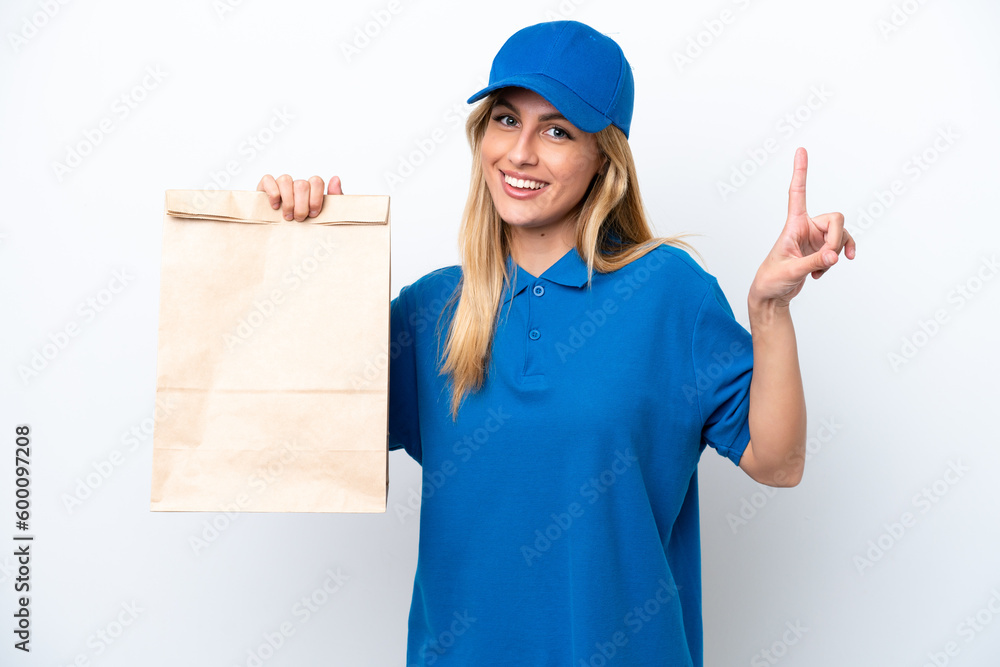 Young Uruguayan woman taking a bag of takeaway food isolated on white background pointing up a great idea Young Uruguayan woman taking a bag of takeaway food isolated on white background pointing up a great idea