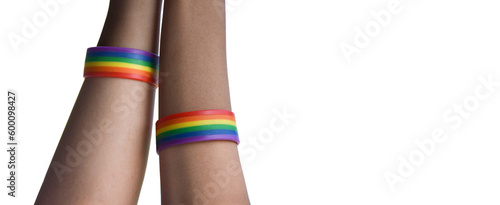 Isolated gay couple hands which wear rainbow wristband around on white background with clippping paths.