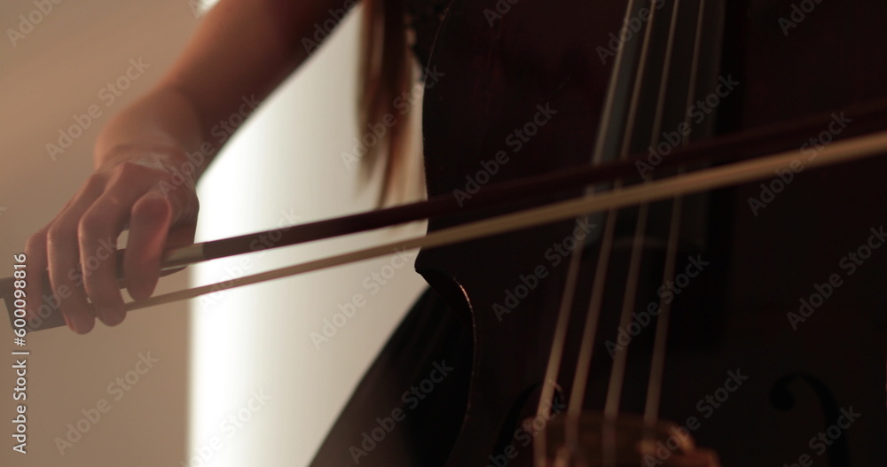 Single woman playing the cello, close-up and medium close-up, cello bow and strings, smooth transitions of the camera from focus to out-of-focus, beautiful filmic, artistic shots. Single woman playing the cello, close-up and medium close-up, cello bow and strings, smooth transitions of the camera from focus to out-of-focus, beautiful filmic, artistic shots.