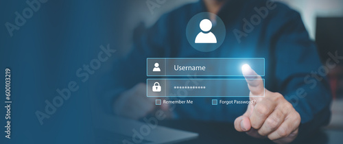 Businessman use laptop login register username and password identity on webpage concepts of cyber security, internet access, join social or personal data protection or forget pass key unlock. photo