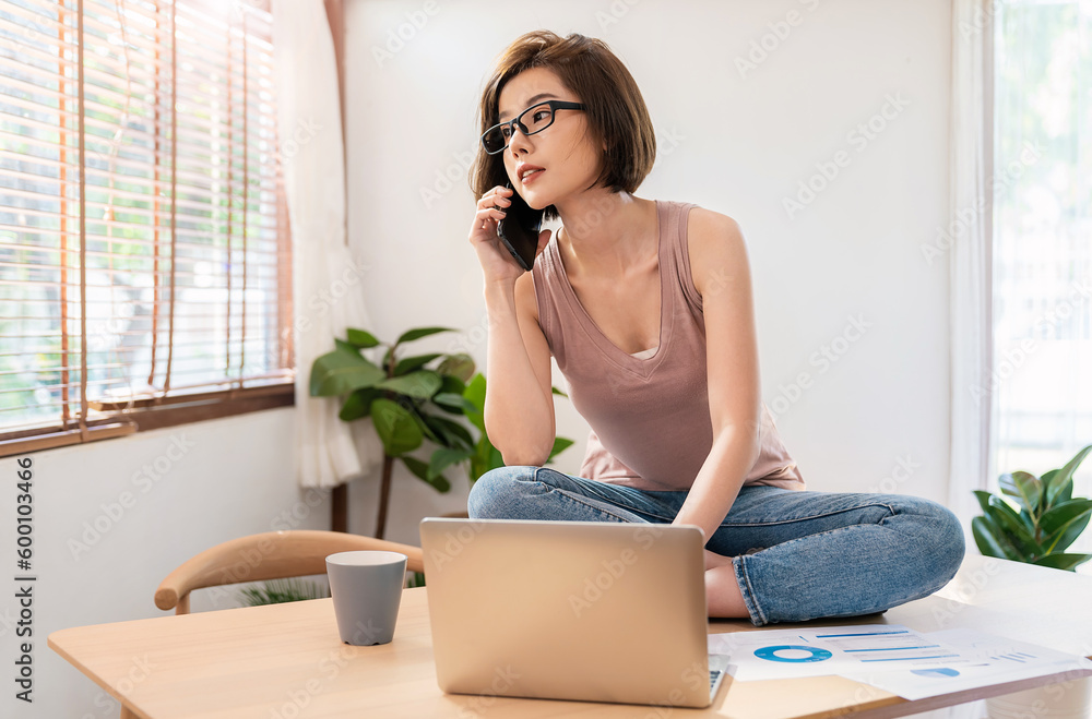 Portrait of smiling beautiful business asian woman working in office using computer with copy space. Business people freelance online marketing e-commerce telemarketing sme, work from home concept Portrait of smiling beautiful business asian woman working in office using computer with copy space. Business people freelance online marketing e-commerce telemarketing sme, work from home concept