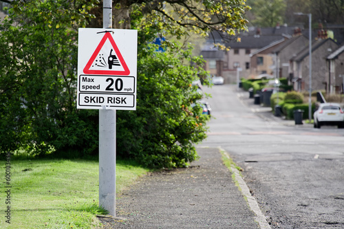 Skid risk road speed limit safety sign