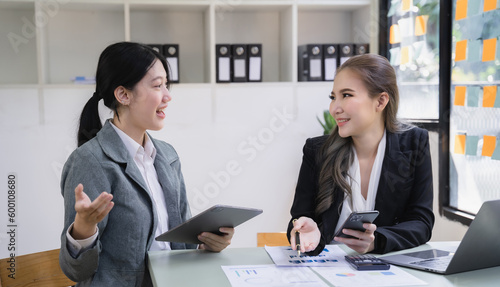 Wallpaper Mural Business corporate team brainstorming, planning strategy having a discussion Analysis investment researching with chart at office desk documents in office. Torontodigital.ca