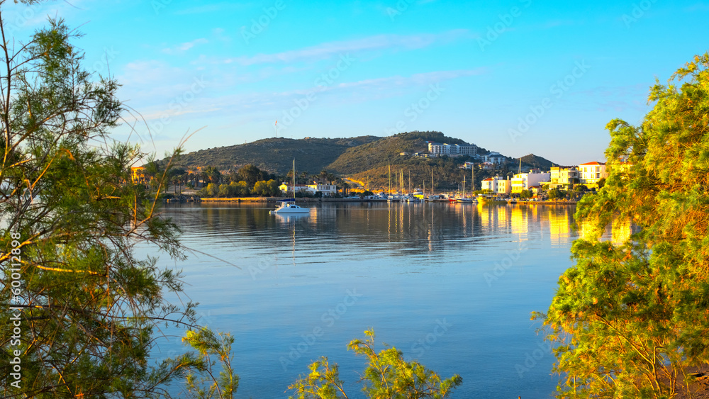 Obraz premium Calm sea and reflections at sunrise in Datça, the famous holiday resort of Muğla on the Aegean coast of Turkey