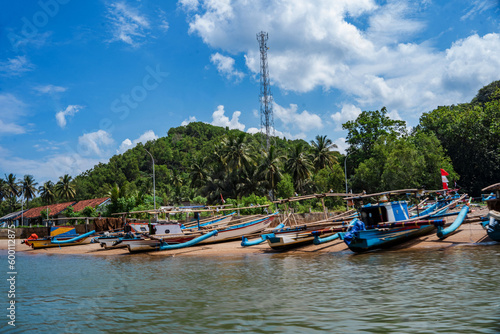 Wallpaper Mural Local fishermen boats line up by the Kali Cokel or Cokel River, Pacitan. Indonesia. Torontodigital.ca
