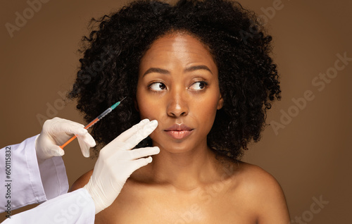 Beautiful african american woman have beauty injections session
