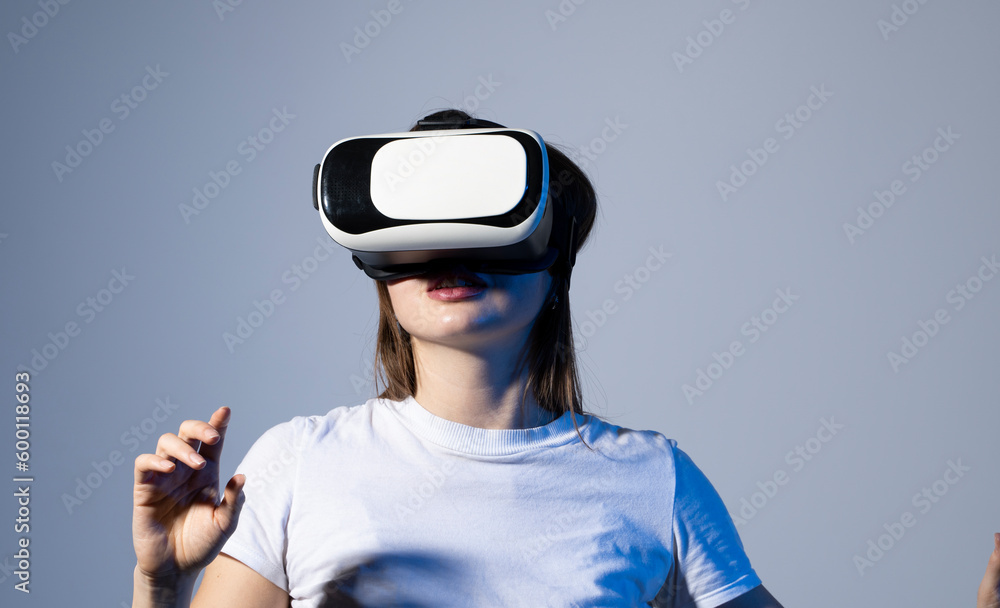 Young brunette woman in vr glasses and workung in virtual simulated world. Future technology digital cyber universe. Young brunette woman in vr glasses and workung in virtual simulated world. Future technology digital cyber universe.