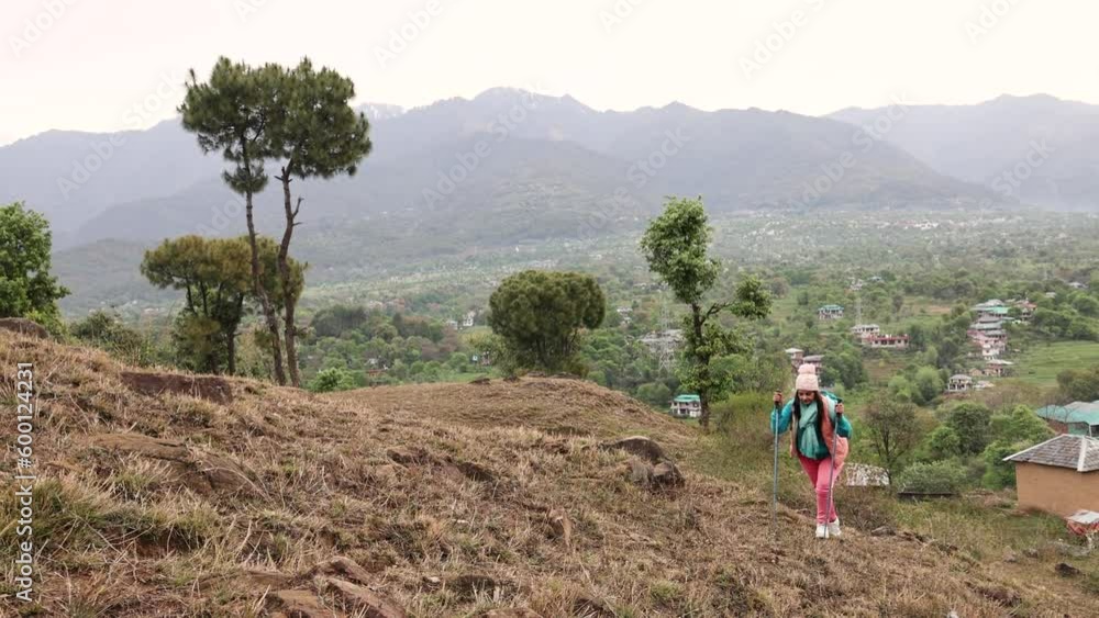 Senior tourist woman hiking at the beautiful mountains Senior tourist woman hiking at the beautiful mountains