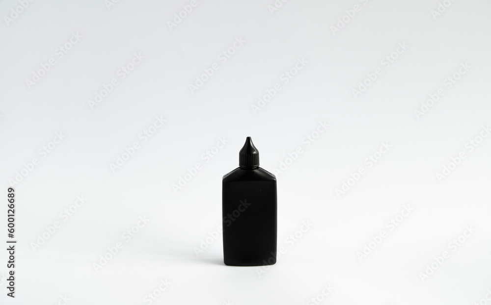 Obraz premium Mock up unbranded black bottle of finish line dry bicycle lubricant. Bicycle care, bicycle chain care.