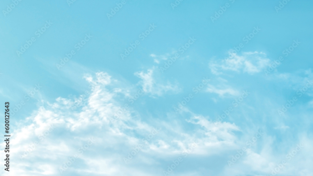 Obraz premium Blue pastel colour sky with white clouds background. Soft blurred cloudscape background. 