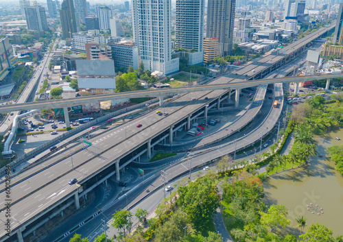 Aerial view of cars driving on Ladprao highway junction or moterway. Overpass bridge street roads in connection network of architecture concept. Top view. Urban city, Bangkok, Thailand.