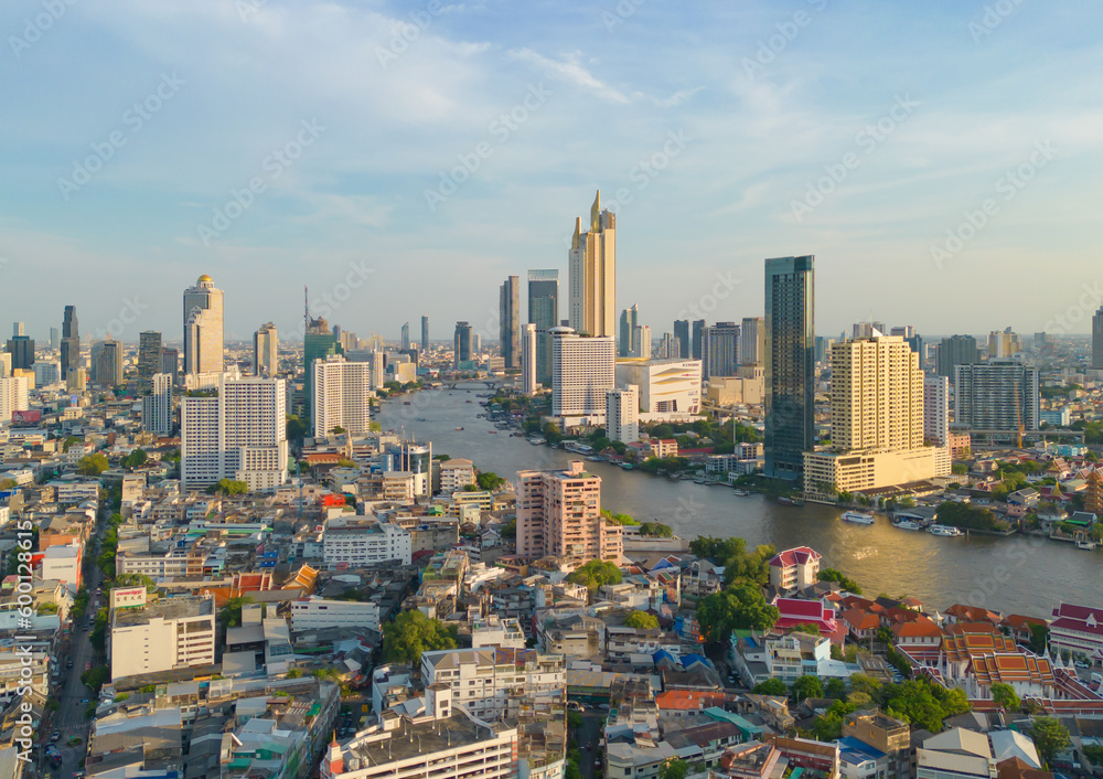 Fototapeta premium Aerial view of Bangkok Downtown Skyline, Thailand. Financial district and business centers in smart urban city in Asia. Skyscraper and high-rise buildings with Chao Phraya River.