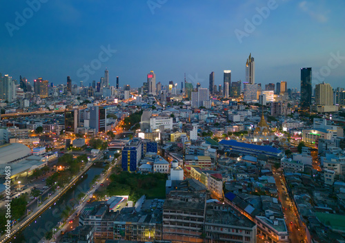 Aerial view of Bangkok Downtown skyline, highway roads or street in Thailand. Financial district and business area in smart urban city. Skyscraper and high-rise buildings at night.