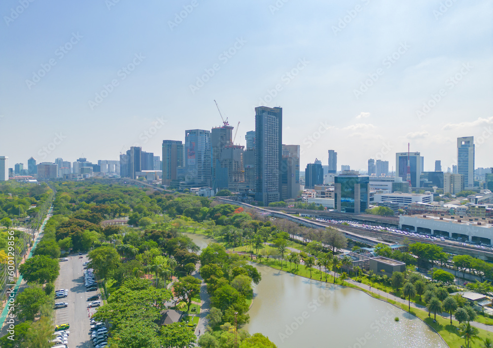 Aerial view of green trees in Lumpini Park, Sathorn district, Bangkok Downtown Skyline. Thailand. Financial district and business center in smart urban city in Asia. Skyscraper buildings Aerial view of green trees in Lumpini Park, Sathorn district, Bangkok Downtown Skyline. Thailand. Financial district and business center in smart urban city in Asia. Skyscraper buildings